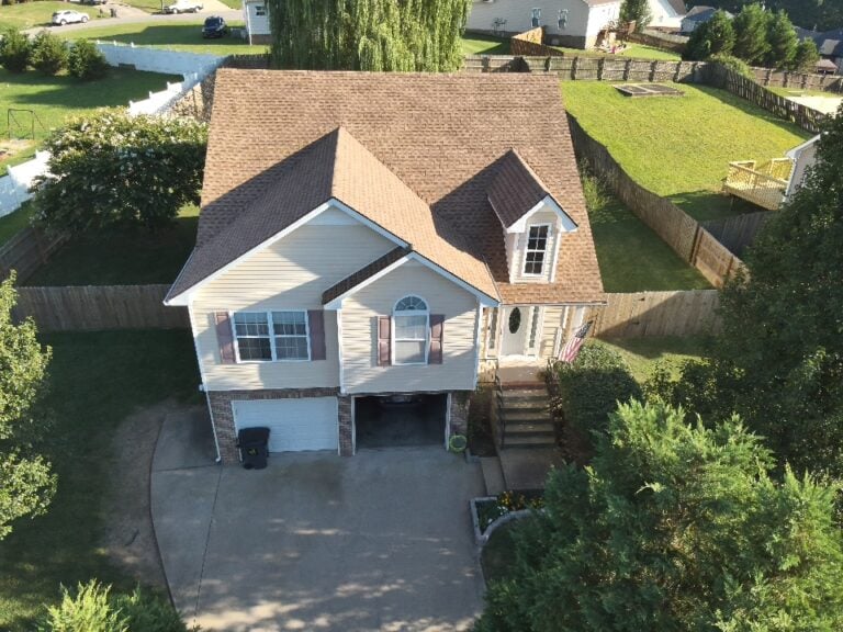 beige siding house brown asphalt roof summit project