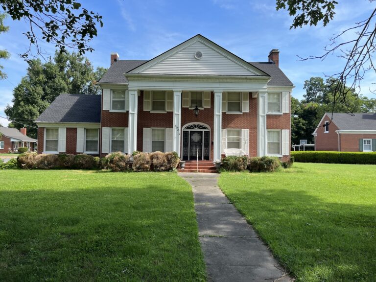 brick residential house white shutters asphalt roof summit project