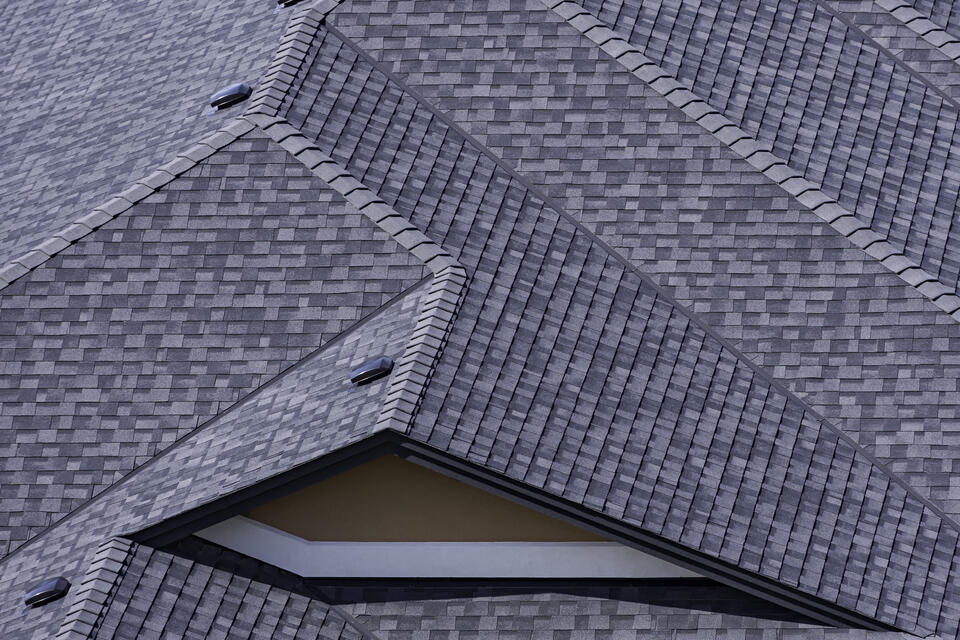 architectural shingles-close up of dark gray shingles on house roof