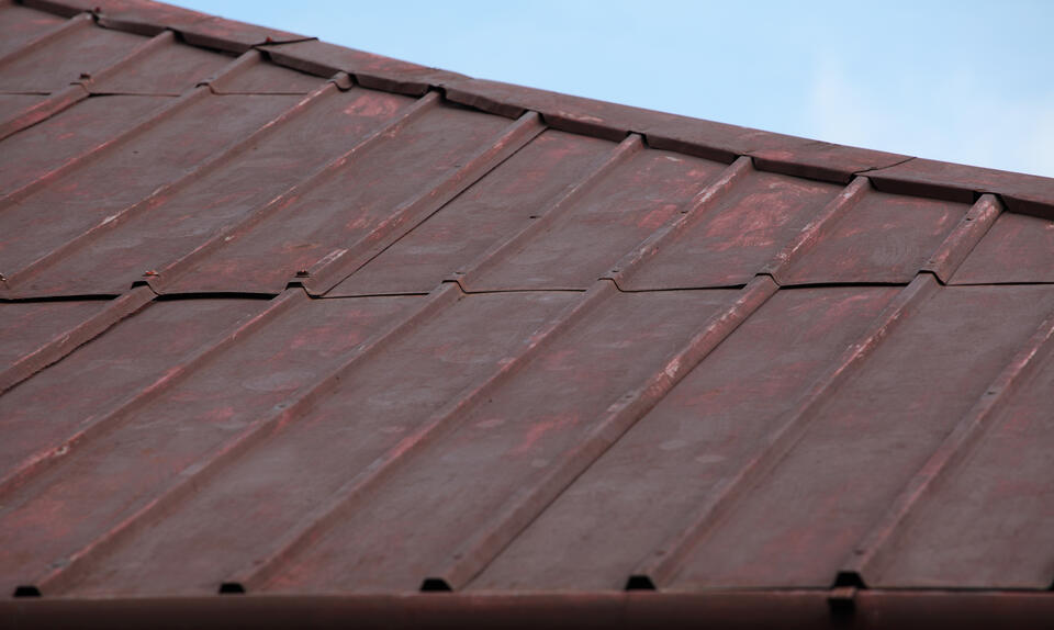 how to clean a metal roof-dirty standing seam metal roofing