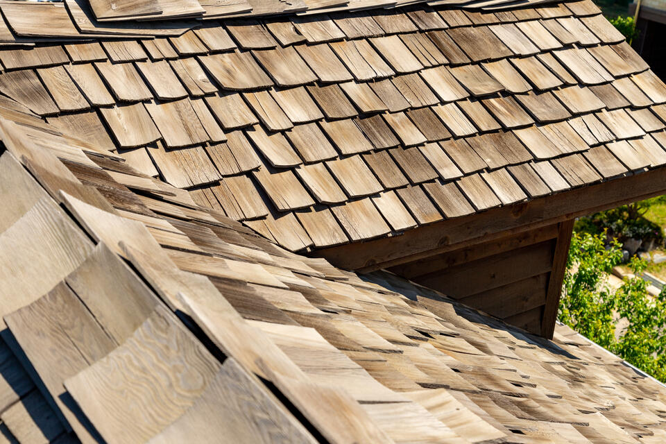 types of roof shingles-wood shakes on house roof