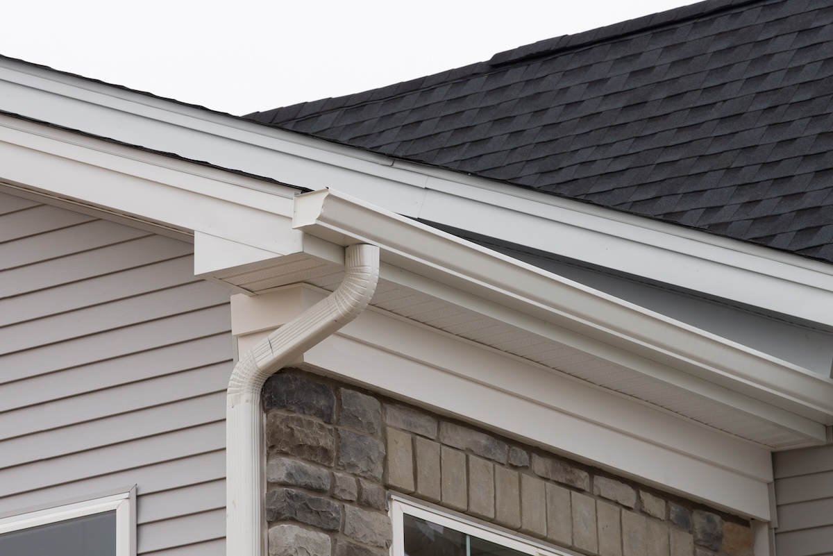 closeup gray residential house with white fascia