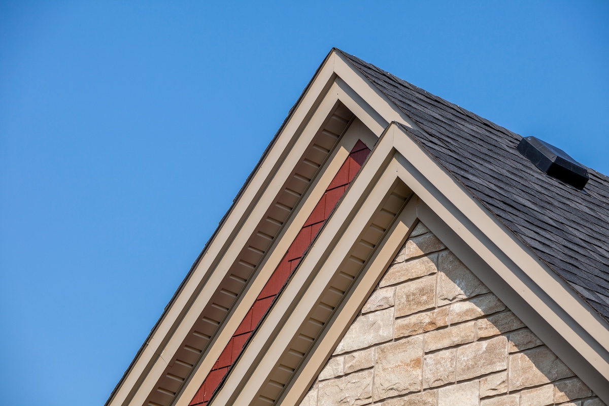 red siding house beige fascia